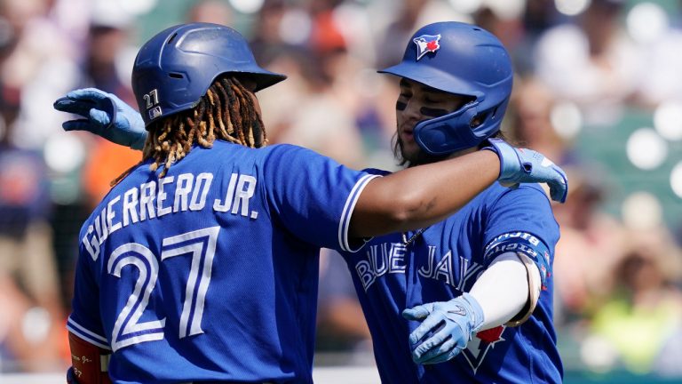 Toronto Blue Jays shortstop Bo Bichette, right, is greeted by Vladimir Guerrero Jr. after hitting a solo home run against Detroit Tigers starting pitcher Matthew Boyd. (Carlos Osorio/AP)