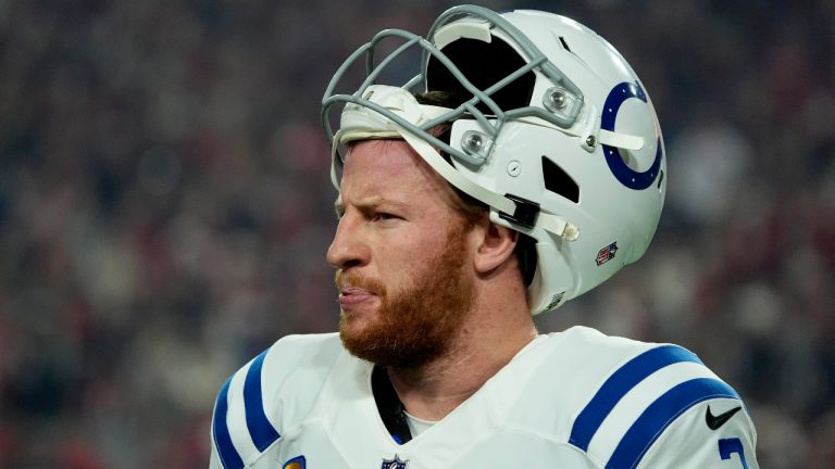 Indianapolis Colts quarterback Carson Wentz (2) looks to the bench during the first half of an NFL football game against the Arizona Cardinals, Saturday, Dec. 25, 2021, in Glendale, Ariz. (Rick Scuteri/AP)