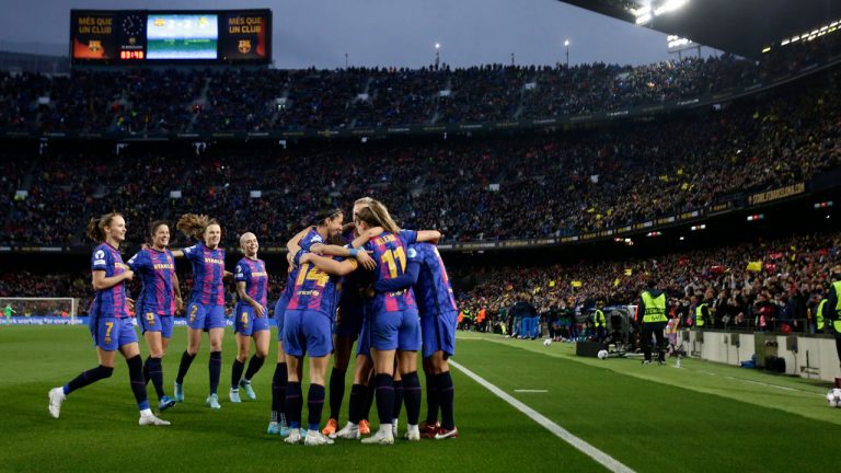 Barcelona celebrate the third goal against Real Madrid during the Women's Champions League quarter final, second leg soccer match between Barcelona and Real Madrid at Camp Nou stadium in Barcelona. (Joan Monfort/AP)