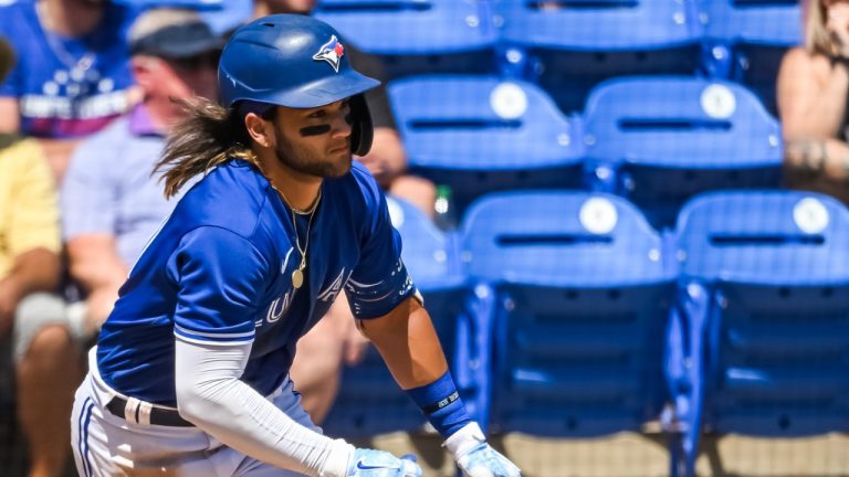 Toronto Blue Jays’ Bo Bichette hits a ground ball single off New York Yankees’ Ron Marinaccio during the fourth inning of a spring training baseball game at TD Ballpark Tuesday, March 22, 2022, in Dunedin, Fla. (Steve Nesius/CP)