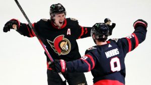 Ottawa Senators centre Josh Norris (9) celebrates his game winning goal with defenceman Thomas Chabot (72) during overtime period NHL hockey action in Ottawa, on Thursday, March 10, 2022. (Justin Tang/CP)