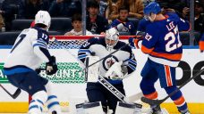 With Connor Hellebuyck struggling, Dave Lowry faces toughest decision with Jets