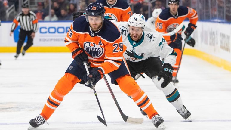 San Jose Sharks' Noah Gregor (73) chases Edmonton Oilers' Leon Draisaitl (29) during first period NHL action in Edmonton on Thursday, March 24, 2022. (Jason Franson/THE CANADIAN PRESS)