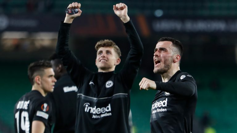 Eintracht Frankfurt players celebrate during the Europa League, round of 16, first leg soccer match between Betis and Frankfurt at the Benito Villamarin stadium in Seville, Spain, Wednesday, March 9, 2022. (Angel Fernandez/AP)