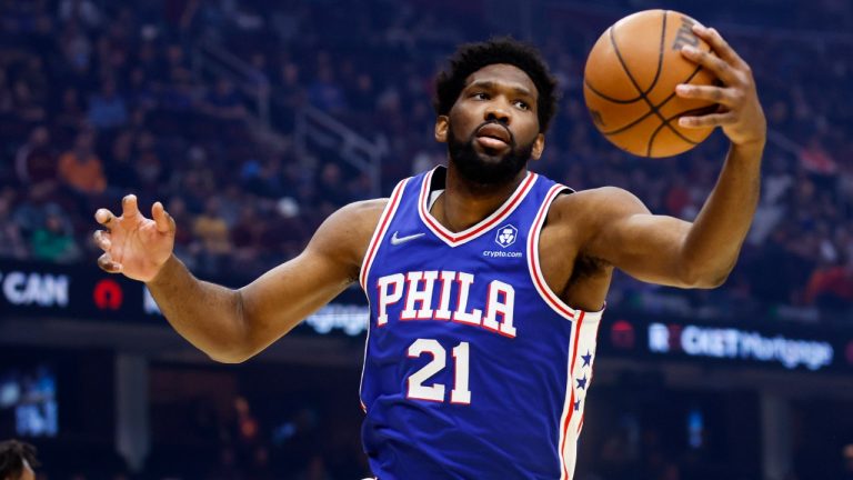 Philadelphia 76ers' Joel Embiid pulls in a rebound during the first half of the team's NBA basketball game against the Cleveland Cavaliers, Wednesday, March 16, 2022, in Cleveland. (Ron Schwane/AP)