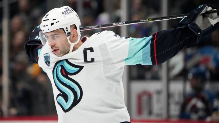 Seattle Kraken defenseman Mark Giordano stretches before the third period of an NHL hockey game against the Colorado Avalanche, Monday, Jan. 10, 2022, in Denver. (David Zalubowski/AP)