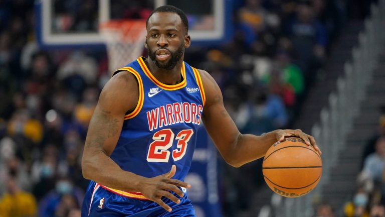 Golden State Warriors forward Draymond Green (23) dribbles the ball up the court against the Memphis Grizzlies during the first half of an NBA basketball game in San Francisco, Thursday, Dec. 23, 2021. (Jeff Chiu/AP)