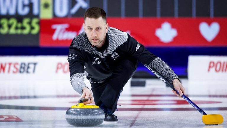 Team Wild Card One skip Brad Gushue makes a shot while playing Team Northern Ontario at the Tim Hortons Brier in Lethbridge, Alta., Sunday, March 6, 2022. (Jeff McIntosh/CP)