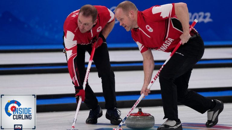 Canada's Geoff Walker, left, and Mark Nichols sweep the ice during the men's curling bronze medal match between Canada and the United States at the Beijing Winter Olympics Friday, Feb. 18, 2022, in Beijing. (Nariman El-Mofty/AP)