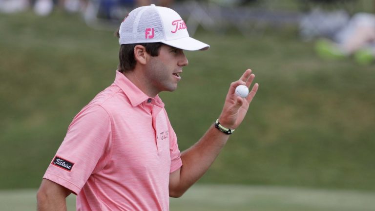 Ben Martin shows his ball after making a birdie putt on the second hole, during the final round of The Players Championship golf tournament Sunday, May 14, 2017, in Ponte Vedra Beach, Fla. (Chris O'Meara/AP)