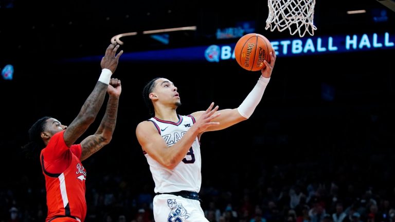 Gonzaga guard Andrew Nembhard, right, goes up for a shot against Texas Tech guard Davion Warren, left, during the first half of an NCAA college basketball game at the Jerry Colangelo Classic Saturday, Dec. 18, 2021, in Phoenix. (Ross D. Franklin/AP)