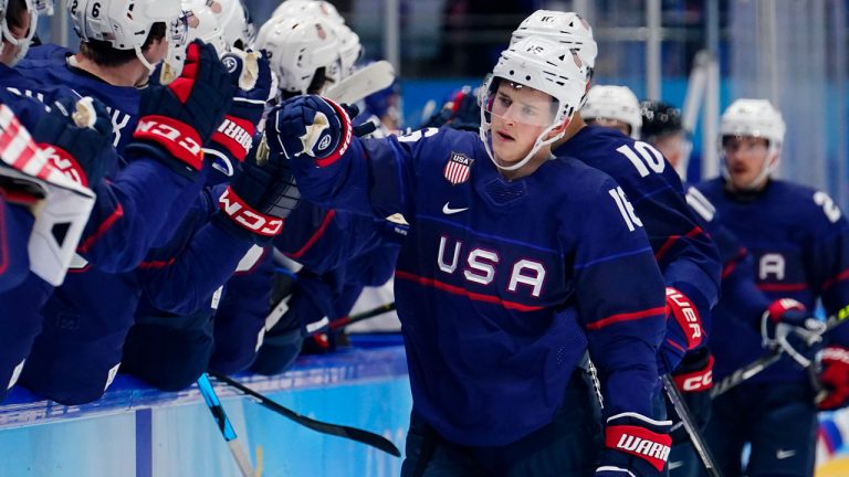 United States' Nick Abruzzese (16) is congratulated after scoring a goal against Slovakia during a men's quarterfinal hockey game at the 2022 Winter Olympics. (Matt Slocum/AP)