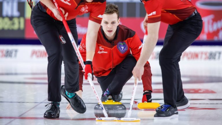 Team Newfoundland and Labrador skip Nathan Young makes as shot as he plays Team Alberta at the Tim Hortons Brier in Lethbridge, Alta., Saturday, March 5, 2022. (Jeff McIntosh/CP)