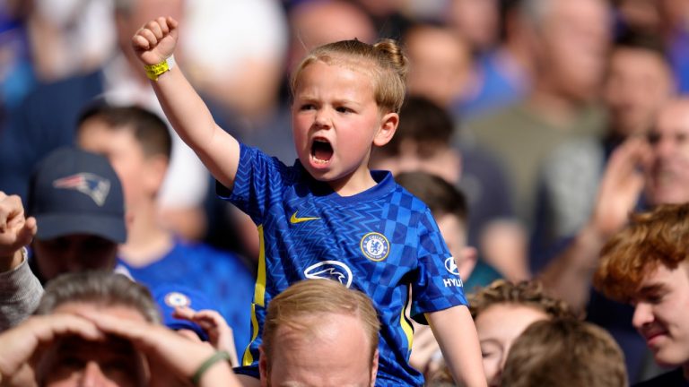 A young Chelsea fan cheers on the stands before the start of the English FA Cup semifinal soccer match between Chelsea and Crystal Palace at Wembley stadium in London, Sunday, April 17, 2022. (Kirsty Wigglesworth/AP)