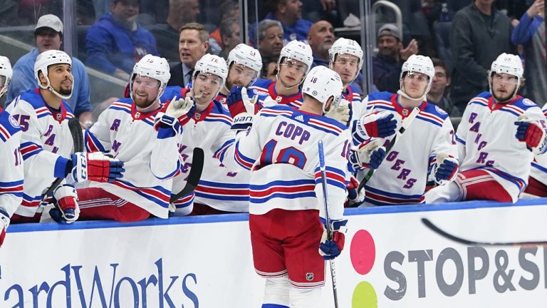 New York Rangers' Andrew Copp (18) is congratulated by teammates after scoring a goal during the first period of the team's NHL hockey game. (Frank Franklin II/AP)