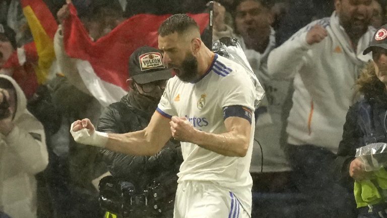 Real Madrid's Karim Benzema celebrates after scoring his side's first goal during a Champions League first-leg quarterfinal soccer match between Chelsea and Real Madrid at Stamford Bridge stadium in London, Wednesday, April 6, 2022. (Kirsty Wigglesworth/AP)