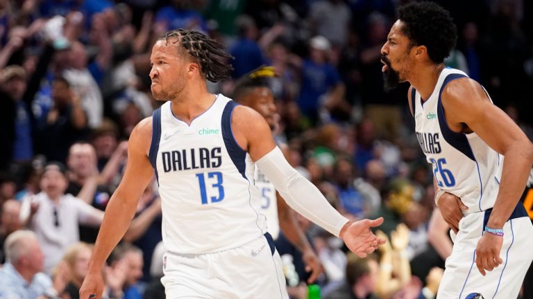 Dallas Mavericks guard Jalen Brunson (13) and Spencer Dinwiddie, right, celebrate a 3-point basket made by Brunson in the first half of Game 2 of an NBA basketball first-round playoff series against the Utah Jazz, Monday, April 18, 2022, in Dallas. (Tony Gutierrez/AP)