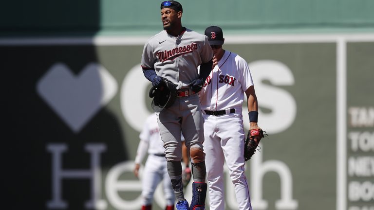 Minnesota Twins' Byron Buxton, front, reacts after being injured on his double during the first inning of a baseball game against the Boston Red Sox. (Michael Dwyer/AP)