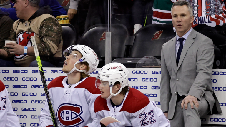 Montreal Canadiens head coach Martin St. Louis, right, looks on during the second period of an NHL hockey game against the New Jersey Devils, Sunday, March 27, 2022, in Newark, N.J. (AP/file)