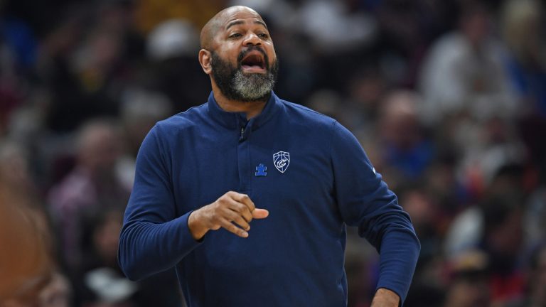 Cleveland Cavaliers head coach J.B. Bickerstaff shouts from the bench in the first half of an NBA basketball game against the Philadelphia 76ers, Sunday, April 3, 2022, in Cleveland. (AP Photo/David Dermer)