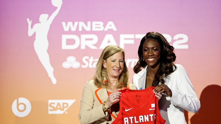 Kentucky's Rhyne Howard, right, poses for a photo with commissioner Cathy Engelbert after being selected by the Atlanta Dream as the first overall pick in the WNBA basketball draft, Monday, April 11, 2022, in New York. (AP Photo/Adam Hunger)