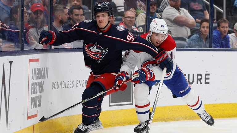 Columbus Blue Jackets' Jack Roslovic, left, and Montreal Canadiens' Nick Suzuki chase the puck during the third period of an NHL hockey game Wednesday, April 13, 2022, in Columbus, Ohio. (Jay LaPrete/AP)