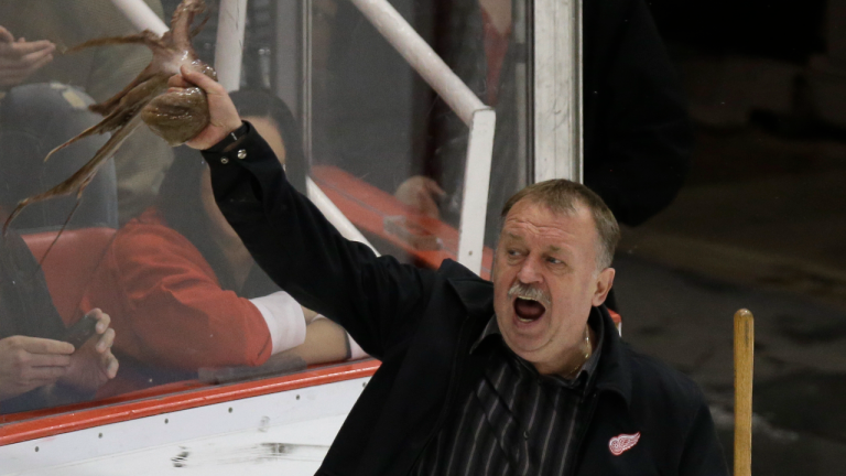 Al Sobotka, building operations manager for Olympia Entertainment, swirls an octopus tossed to the ice during the third period of an NHL hockey game between the Detroit Red Wings and the Nashville Predators in Detroit, April 25, 2013. (AP/file)