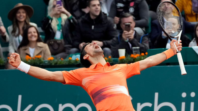 Novak Djokovic of Serbia celebrates at the end of his quarter final tennis match of the Serbia Open tennis tournament against Miomir Kecmanovic of Serbia, in Belgrade, Serbia, Thursday, April 21, 2022. (AP)