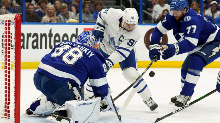 Tampa Bay Lightning goaltender Andrei Vasilevskiy stops Toronto Maple Leafs center John Tavares as defenseman Victor Hedman moves in during the first period of an NHL hockey game Thursday, April 21, 2022, in Tampa, Fla. (AP)