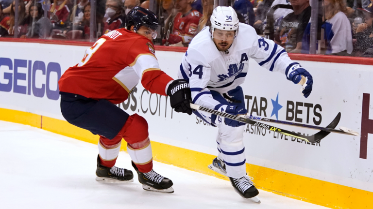 Florida Panthers defenseman Ben Chiarot, left, and Toronto Maple Leafs center Auston Matthews (34) chase the puck during the first period of an NHL hockey game Saturday, April 23, 2022, in Sunrise, Fla. (AP)