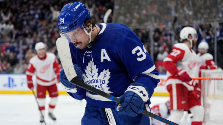 Toronto Maple Leafs centre Auston Matthews (34) celebrates after scoring on Detroit Red Wings goaltender Alex Nedeljkovic (39) during second period NHL hockey action in Toronto, Tuesday, April 26, 2022. It is 59th goal of the season for Matthews. (CP)