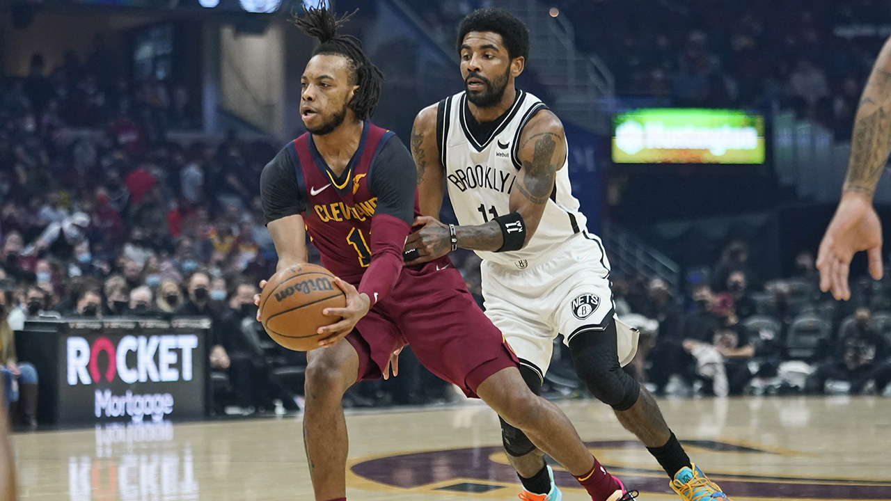 Cleveland Cavaliers' Darius Garland, left, drives against Brooklyn Nets' Kyrie Irving (11) in the first half of an NBA basketball game. (Tony Dejak/AP)