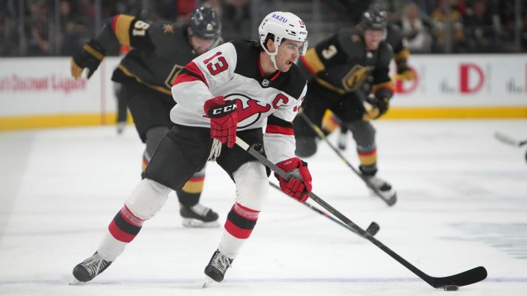 New Jersey Devils centre Nico Hischier (13) advances the puck against the Vegas Golden Knights during the first period of an NHL hockey game Monday, April 18, 2022, in Las Vegas. (Joe Buglewicz/AP)