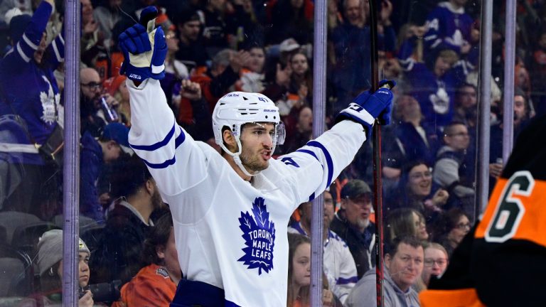 Toronto Maple Leafs' Pierre Engvall celebrates after scoring past Philadelphia Flyers goaltender Carter Hart during the third period of an NHL hockey game, Saturday, April 2, 2022, in Philadelphia. (Derik Hamilton/AP)