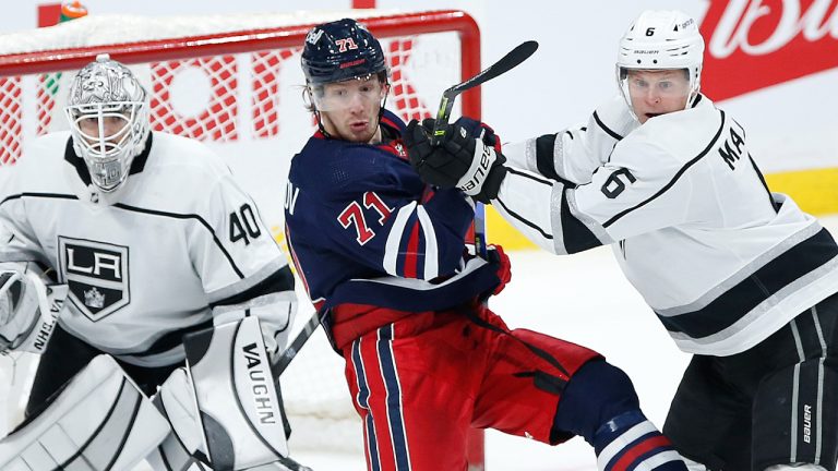 Winnipeg Jets' Evgeny Svechnikov (71) and Los Angeles Kings' Olli Maatta (6) fight for position in front of goaltender Cal Petersen (40) during third period NHL action in Winnipeg on Saturday, November 13, 2021. (John Woods/CP)