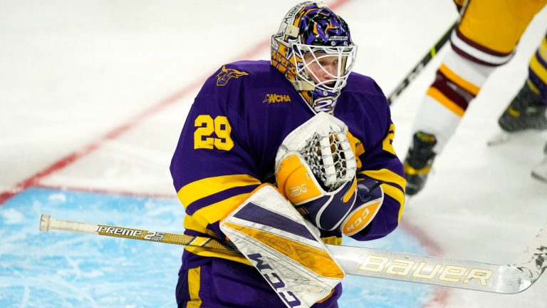 Minnesota State goaltender Dryden McKay makes a save of a shot from a Minnesota player in the third period of an NCAA College Hockey Regional Final, Sunday, March 28, 2021, in Loveland, Colo. (David Zalubowski/AP Photo)