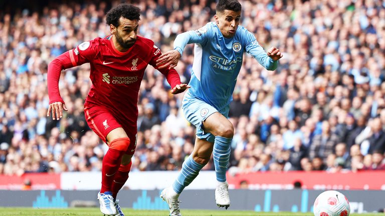 Liverpool’s Mohamed Salah and Man City’s Joao Cancelo battle for the ball during Premier League play. The two teams have played to two 2-2 draws this season. (Darren Sta-ples/Sportimage via PA Images)