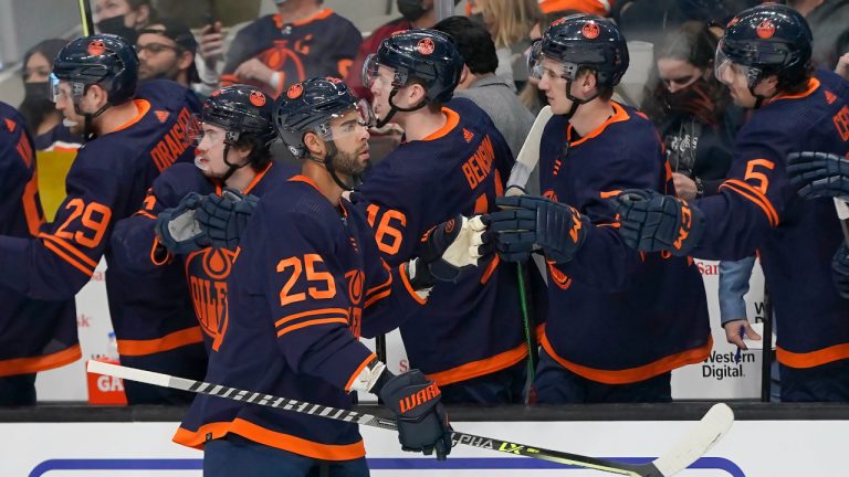 Edmonton Oilers defenceman Darnell Nurse (25) is congratulated by teammates after scoring against the San Jose Sharks during the first period of an NHL hockey game in San Jose, Calif., Monday, Feb. 14, 2022. (Jeff Chiu/AP)