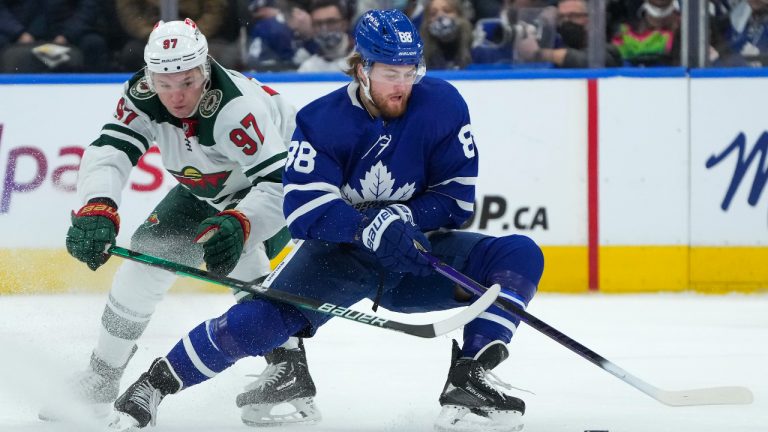 Toronto Maple Leafs forward William Nylander (88) cuts past Minnesota Wild forward Kirill Kaprizov (97) during third period NHL hockey action in Toronto on Thursday, February 24, 2022. (Nathan Denette/AP)