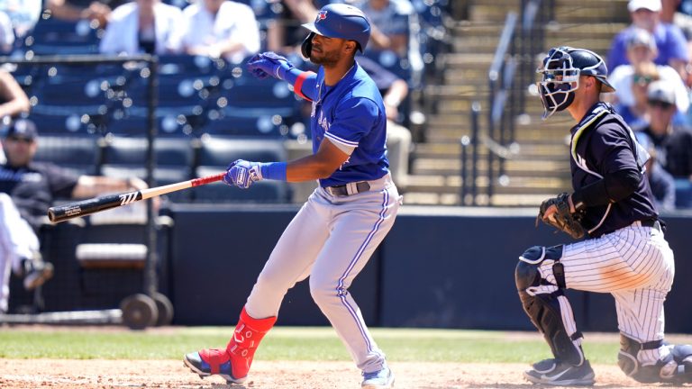 Toronto Blue Jays' Josh Palacios, left, strikes out swinging with the base loaded during the seventh inning of a spring training baseball game against the New York Yankees, Saturday, March 26, 2022, in Tampa, Fla. At right is New York Yankees catcher Max McDowell. (Lynne Sladky/AP)