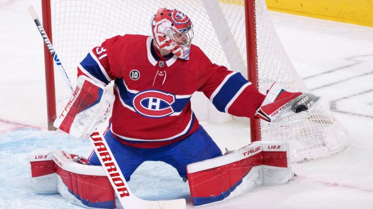 Montreal Canadiens goaltender Carey Price gloves the puck during first period NHL hockey action against the Florida Panthers, in Montreal on Friday, April 29, 2022. (Paul Chiasson/THE CANADIAN PRESS)