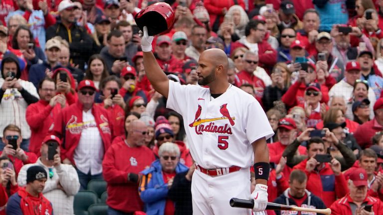 St. Louis Cardinals designated hitter Albert Pujols tips his cap as he steps up to bat during the first inning of a baseball game against the Pittsburgh Pirates Thursday, April 7, 2022, in St. Louis. (Jeff Roberson/AP)