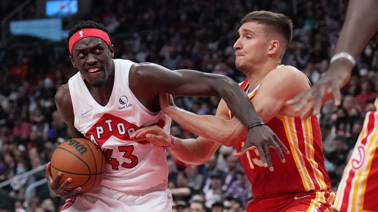 Toronto Raptors forward Pascal Siakam (43) drives to the basket as Atlanta Hawks guard Bogdan Bogdanovic (13) defends during first half NBA basketball action. (Nathan Denette/CP)