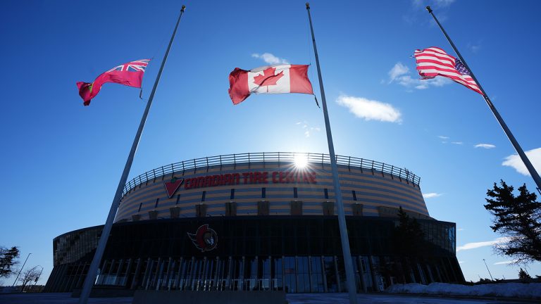 Flags fly at half-mast at the Canadian Tire Centre, the home of the NHL's Ottawa Senators. (Sean Kilpatrick/CP)