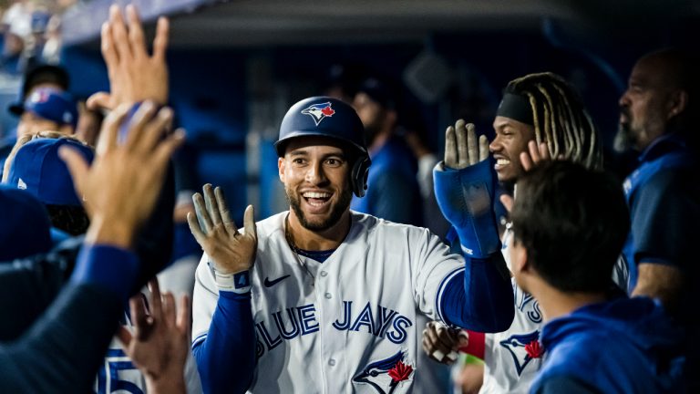 Toronto Blue Jays centre fielder George Springer (4) celebrates after scoring a run during the first inning of AL MLB baseball action against the Texas Rangers, in Toronto on Saturday, April 9, 2022. (Christopher Katsarov/CP)