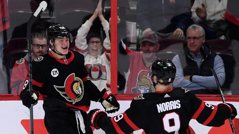 Ottawa Senators left wing Tim Stutzle (18) celebrates his second goal of the game with centre Josh Norris (9) during third period NHL hockey action against the New Jersey Devils in Ottawa, on Tuesday, April 26, 2022. (CP/file)