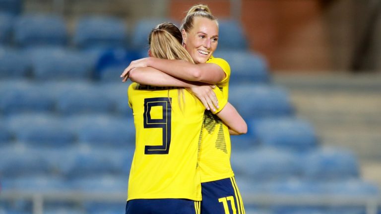 Sweden's Kosovare Asllani celebrates with Stina Blackstenius, right, after scoring her side's third goal during the Algarve Cup women's soccer match between Portugal and Sweden at the Algarve stadium, near Faro, Portugal, Sunday, Feb. 20, 2022. (Joao Matos/AP)