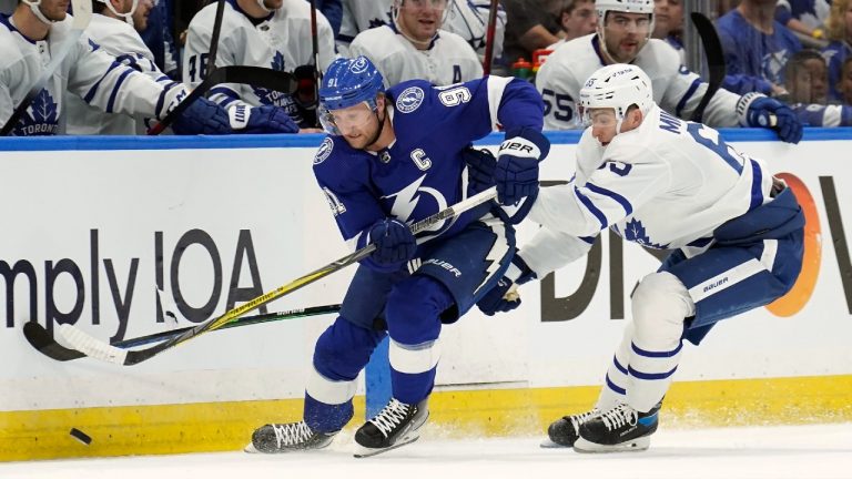 Tampa Bay Lightning center Steven Stamkos (91) moves the puck ahead of Toronto Maple Leafs right wing Ilya Mikheyev (65) during the first period of an NHL hockey game Thursday, April 21, 2022, in Tampa, Fla. (Chris O'Meara/AP)