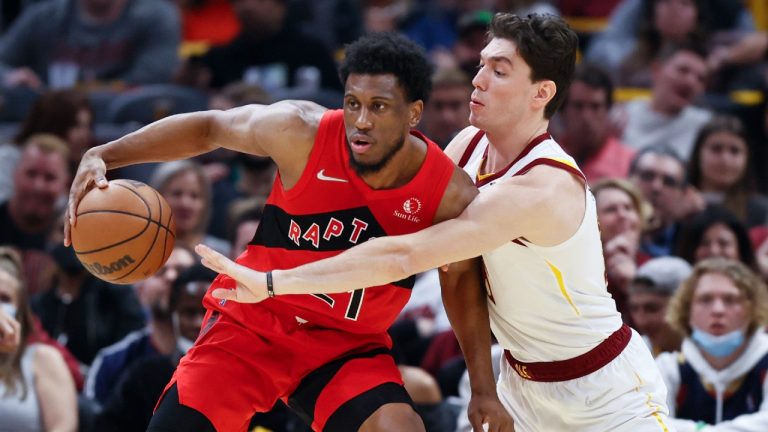 Toronto Raptors' Thaddeus Young (21) works the ball against Cleveland Cavaliers' Cedi Osman (16) during the first half of an NBA basketball game, Sunday, March 6, 2022, in Cleveland. (Ron Schwane/AP)