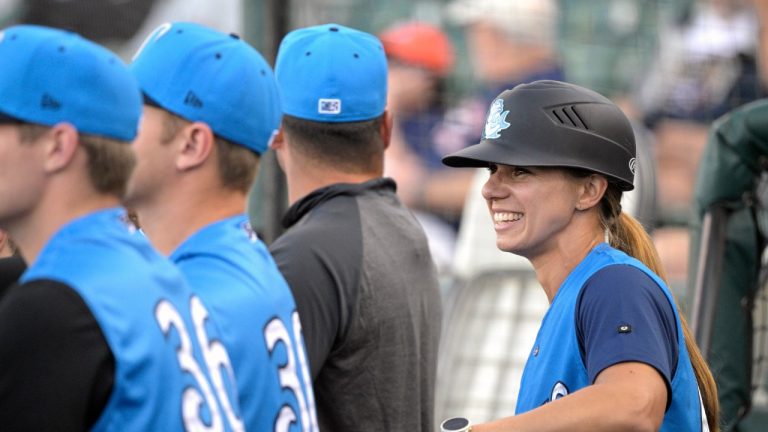 Former Tampa Tarpons manager Rachel Balkovec, right, watches from the dugout, while making her debut as a minor league manager. (Phelan M. Ebenhack/AP)